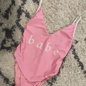 Designer Solkissed 1 pc swimsuit size small. Pink with Babe wording